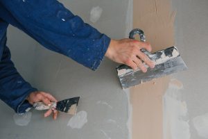 plastering a wall